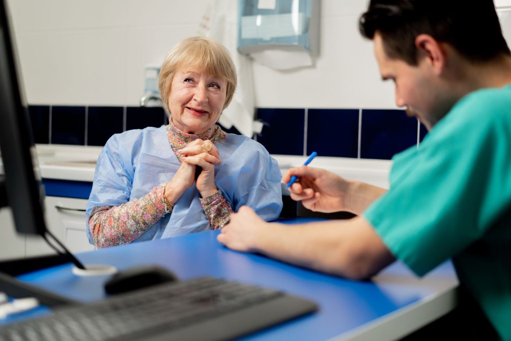 Talking to a patient.