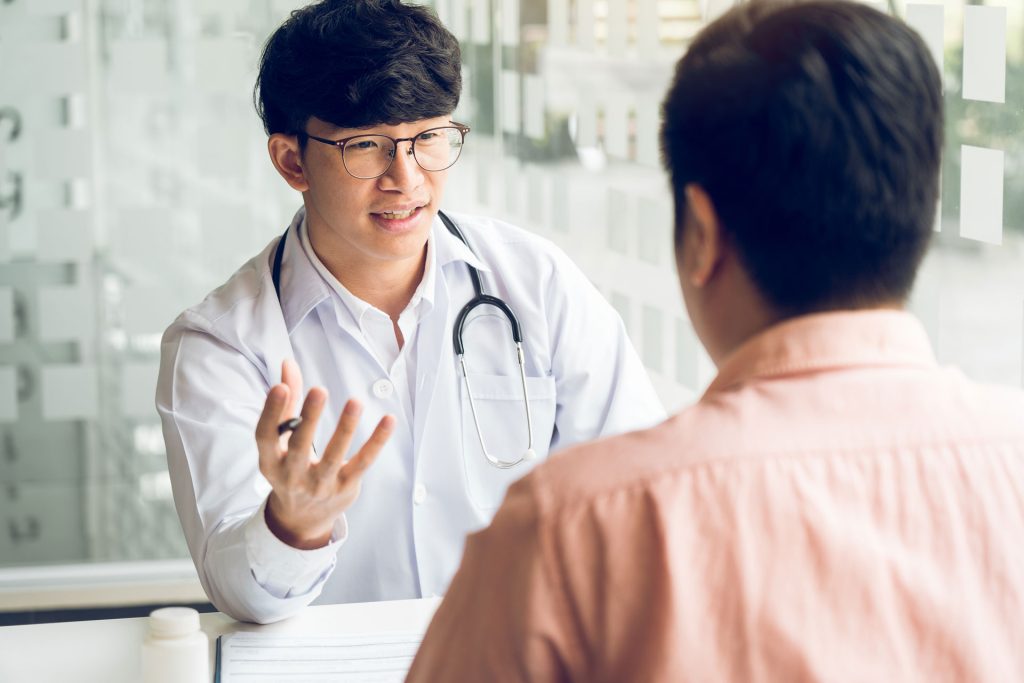 Doctor doing annual checkup to a patient.