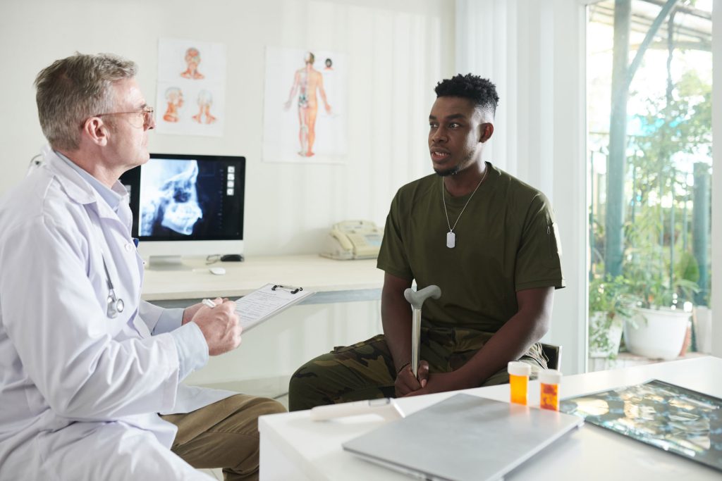 Doctor talking to his patient about chronic disease management.
