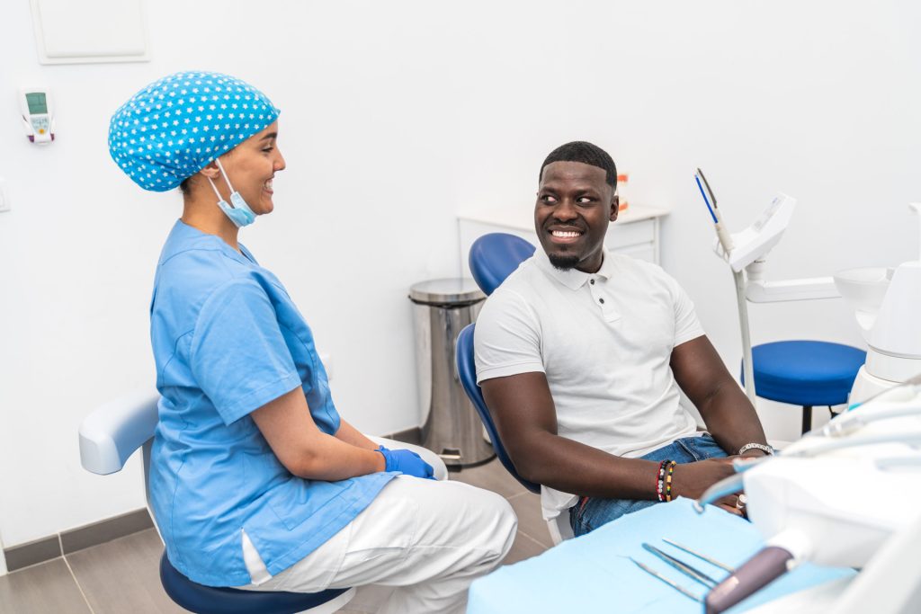 Patient and dental hygienist having a consultation.