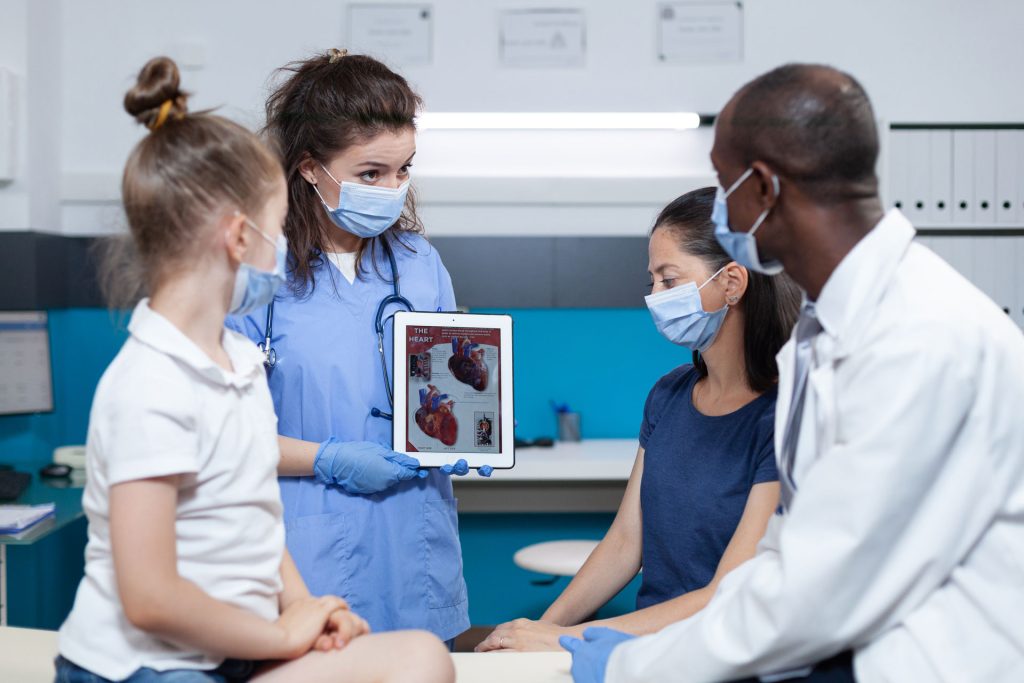 Medical expert holding a tablet during preventative screening.