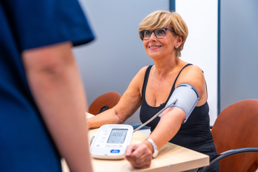 Woman getting her blood pressure in clinic.