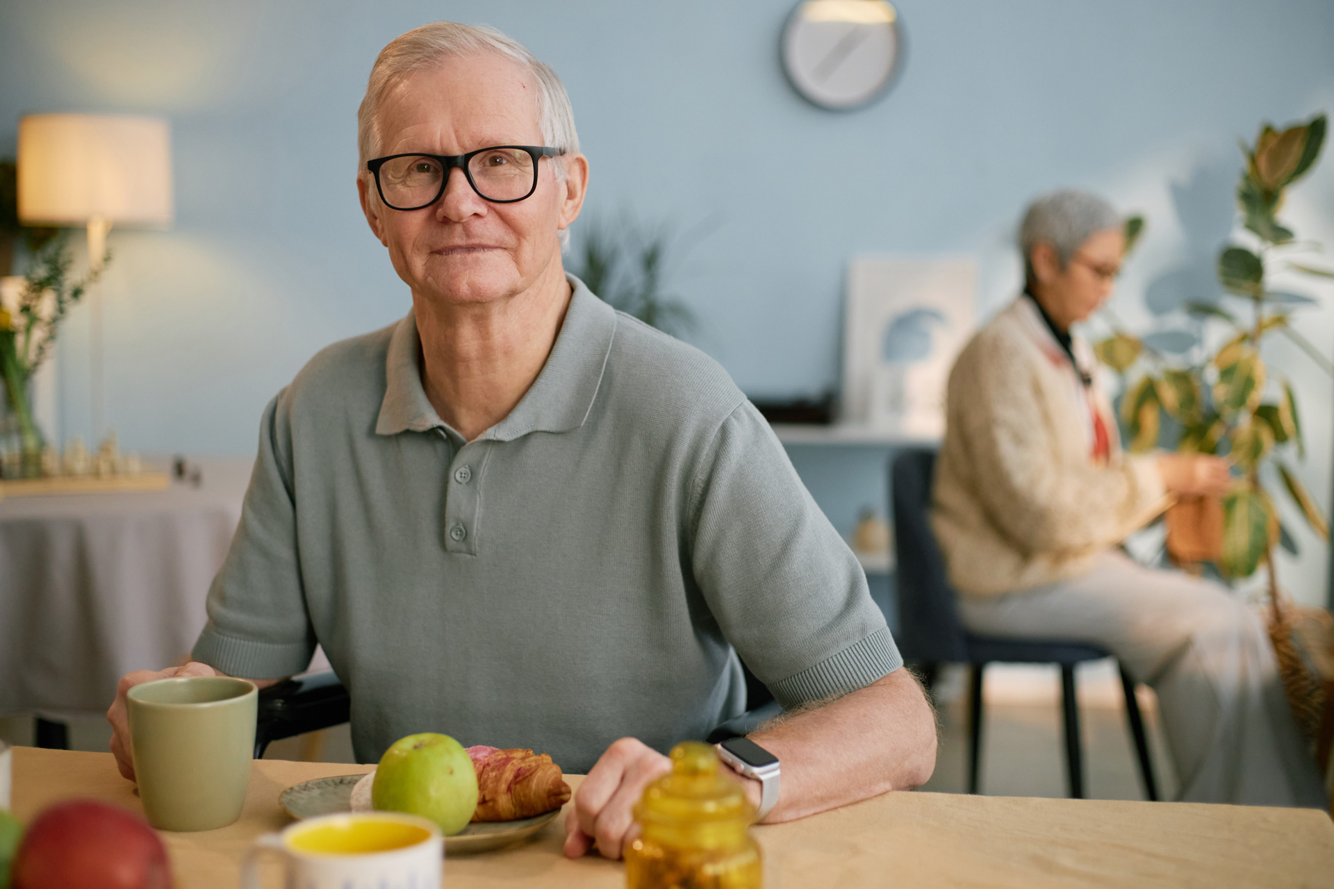 Senior man with chronic health condition eating healthy food.